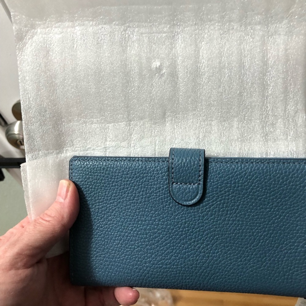 Coach, blue, wallet - phone case. Will not fit 8+ sized phone.